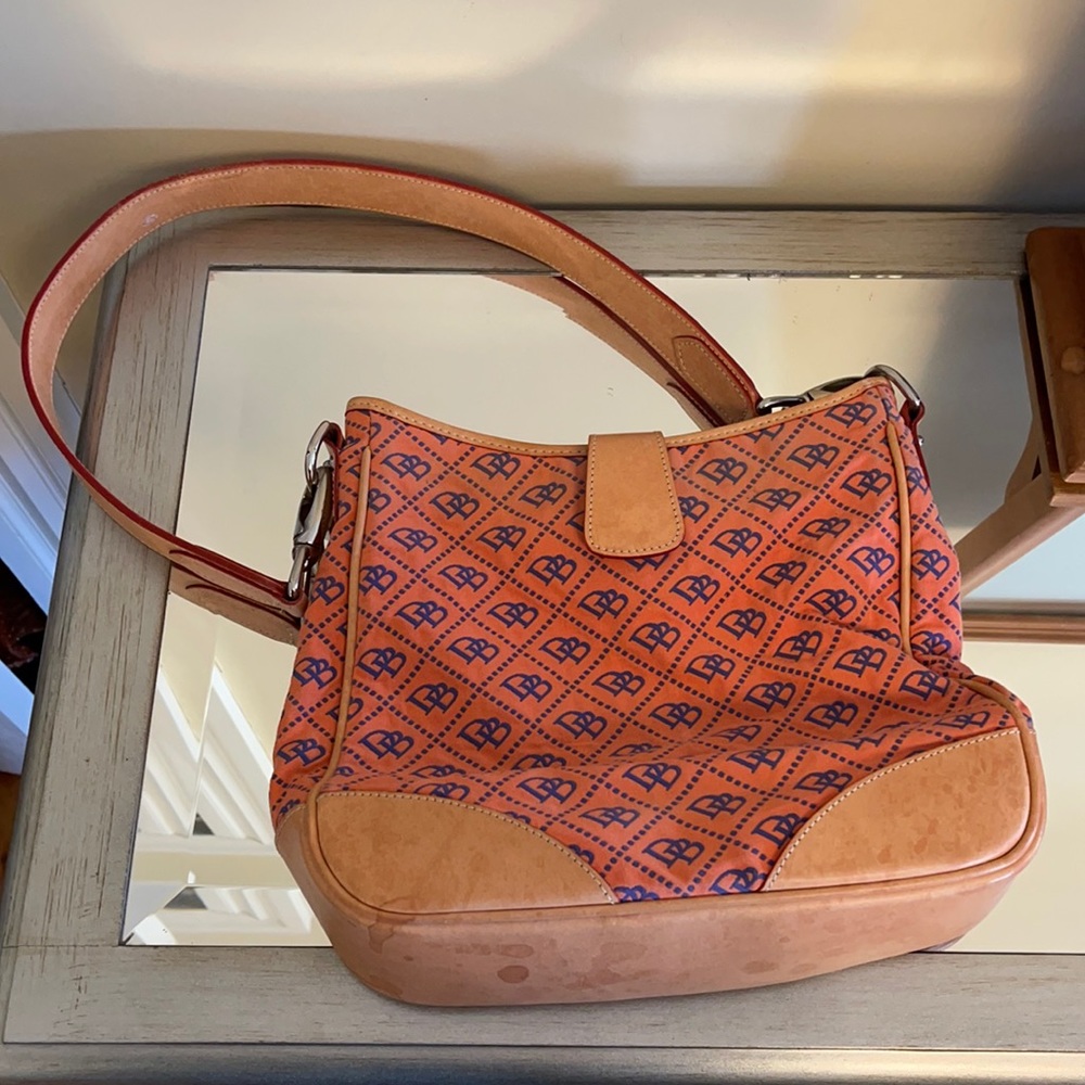 Dooney and Bourke salmon and purple logo hobo shoulder bag.